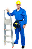 Worker ready to get to work with stepladder