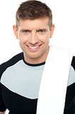 Close up shot of smiling male in sportswear