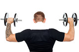 Back pose of male bodybuilder lifting weights