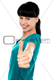 Attractive woman showing thumbs up gesture