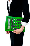 Cropped image of a woman holding big calculator