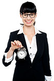 Smiling young lady holding old fashioned time piece