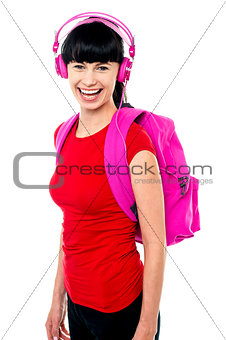 Student enjoying music on her way to college