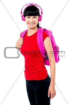 College teen dressed in casuals enjoying music