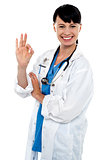 Smiling medical practitioner showing perfect sign