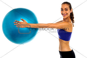 Fitness enthusiast holding a swiss ball