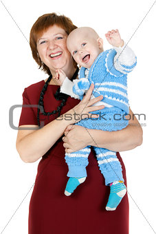 grandmother with her grandson in her arms in the studio