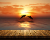 Wooden table looking out to sea with dolphins jumping