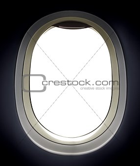 Airplane window view over white