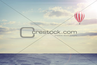 Concrete floor on background of clouds, sun with air balloon