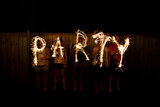 The word Party in sparklers time lapse photography