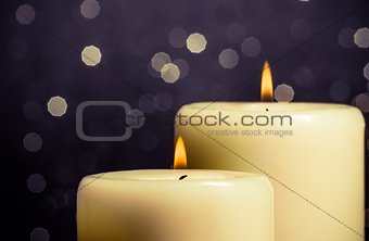 close-up of candles with flame on bokeh