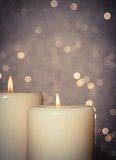candles with flame on bokeh