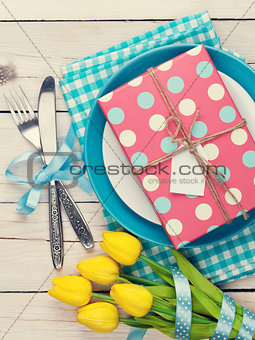 Easter with yellow tulips and gift box