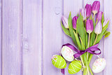 Purple tulip bouquet and easter eggs