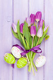 Purple tulip bouquet and easter eggs