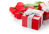 Fresh red tulips with gift boxes