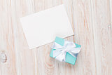 Gift box and blank photo frame or greeting card