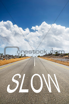 road with text SLOW