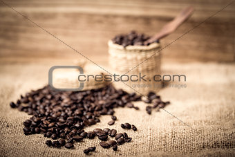 pile of fresh and bio aromatic coffee beans and spoon