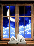 Open book on windowsill