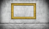old golden frame on gray wall