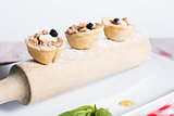 Apple Tarts served on a wooden rolling pin