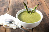 White bowl of cream asparagus soup