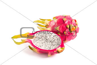 Cut section of dragon fruit and a whole one 