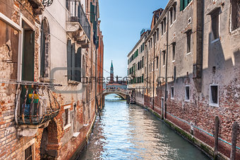 Venetian canal Rio de la Pleto. Old walls with balcony and architecturical elements. Venice, Veneto, Italy