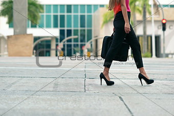 Business woman commuting going to office by walk