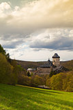 Famous Karlstejn castle  in autumn forest,Czech Republic