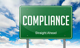 Compliance on Green Highway Signpost.
