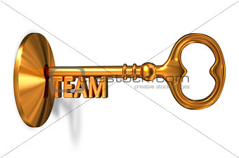 Team - Golden Key is Inserted into the Keyhole.