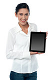 Saleswoman displaying new touch pad device