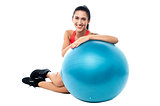 Woman relaxing with exercise ball