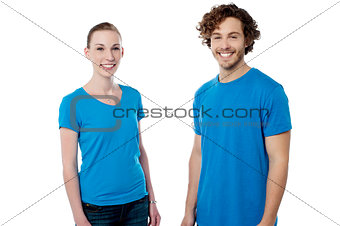 Cheerful young couple posing casually