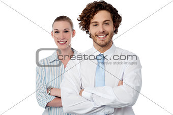 Confident looking young business couple