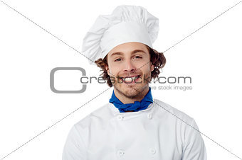 Young male chef wearing toque