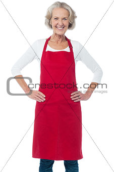 Cheerful aged confident female chef