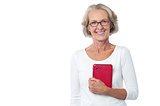 Bespectacled lady posing with tablet pc