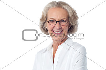 Happy senior woman striking a pose to camera