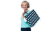Fashionable old lady with shopping bag