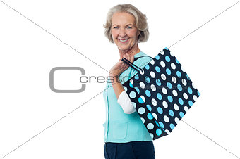 Fashionable old lady with shopping bag