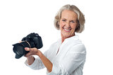 Experienced female photographer with camera