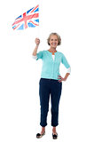 Senior UK supporter waving national flag