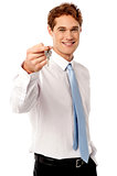 Smiling man offering house key