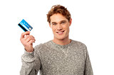 Cool guy showing his credit card