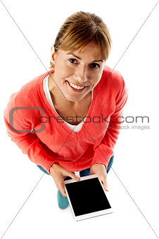 Aerial shot of a lady using tablet pc