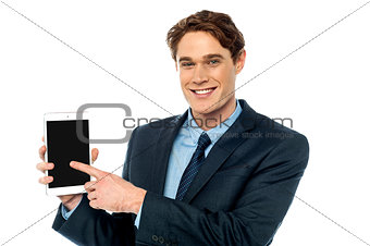 Businessman promoting newly launched tablet